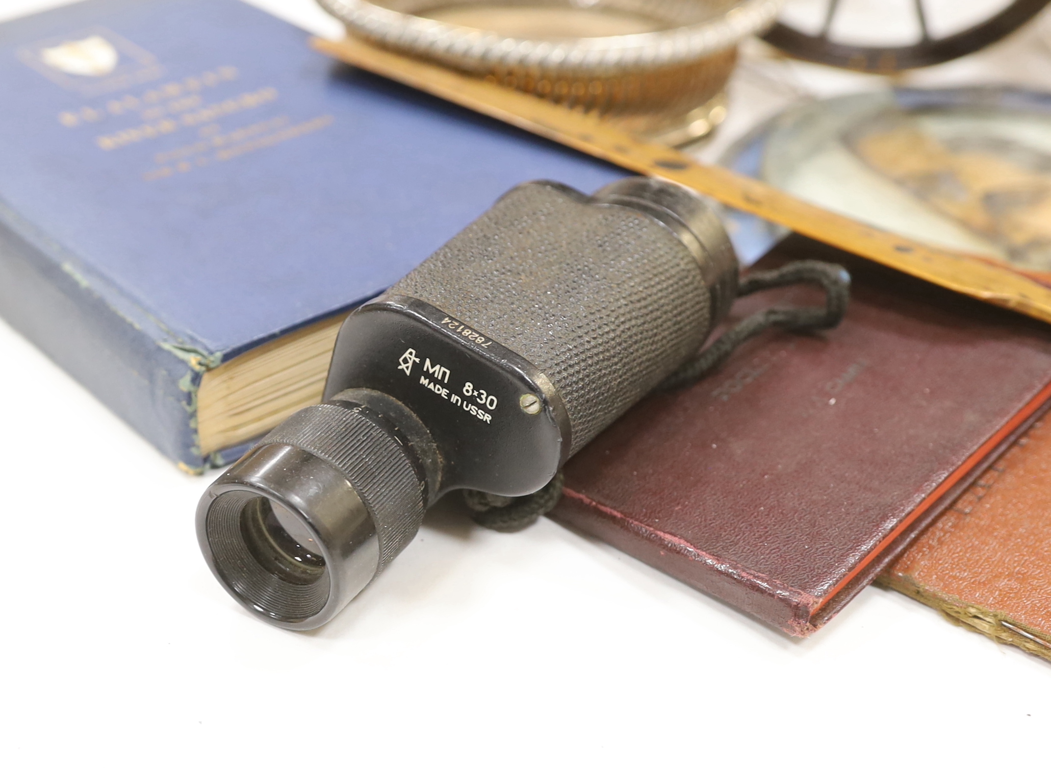 A collection of militaria, including a brass model of a Napoleonic era field gun, a stained glass panel, a Royal Air Force notebook, Civil Defence leaflets, etc.